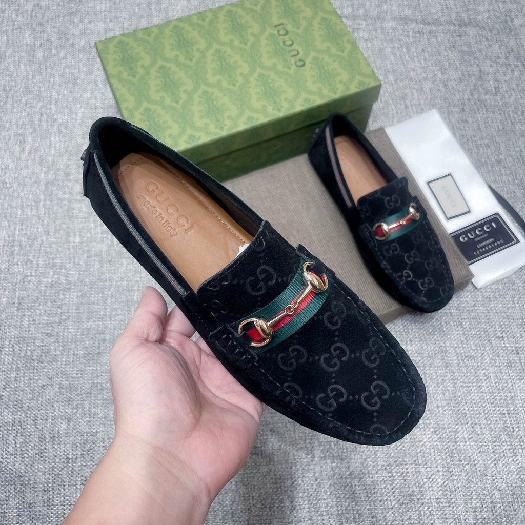 Gucci Black Patterned Loafers with Green and Red Accents — model