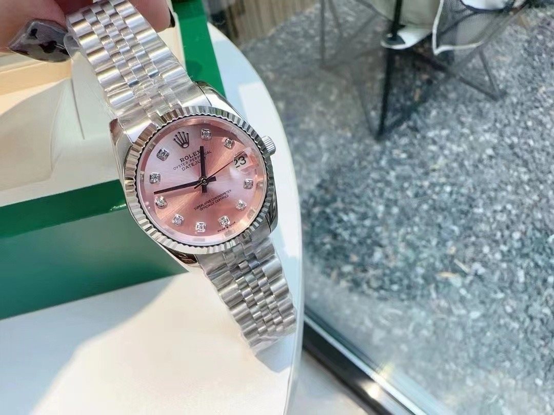 Rolex Pink Dial Silver Bracelet Watch — front