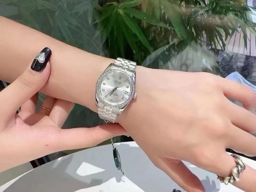 Rolex Pale Iridescent Dial Metal Bracelet Watch — model