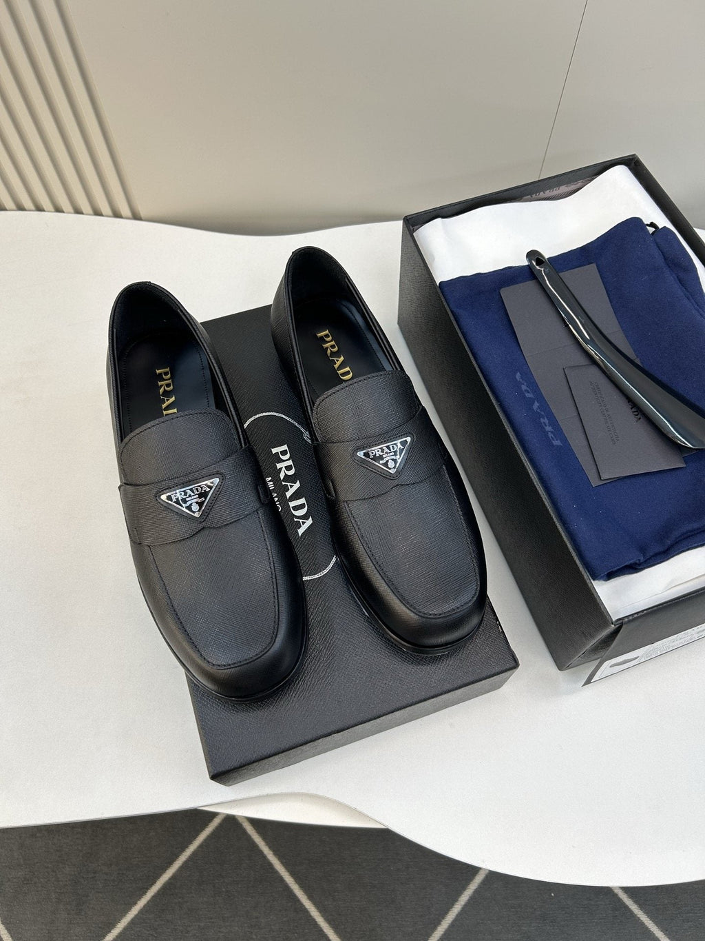 Prada Black Triangular Plaque Loafers — hero