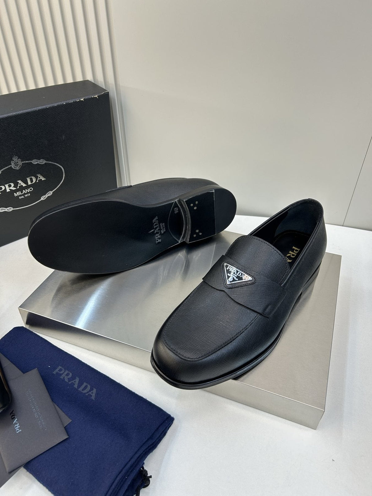 Prada Black Triangular Plaque Loafers — detail