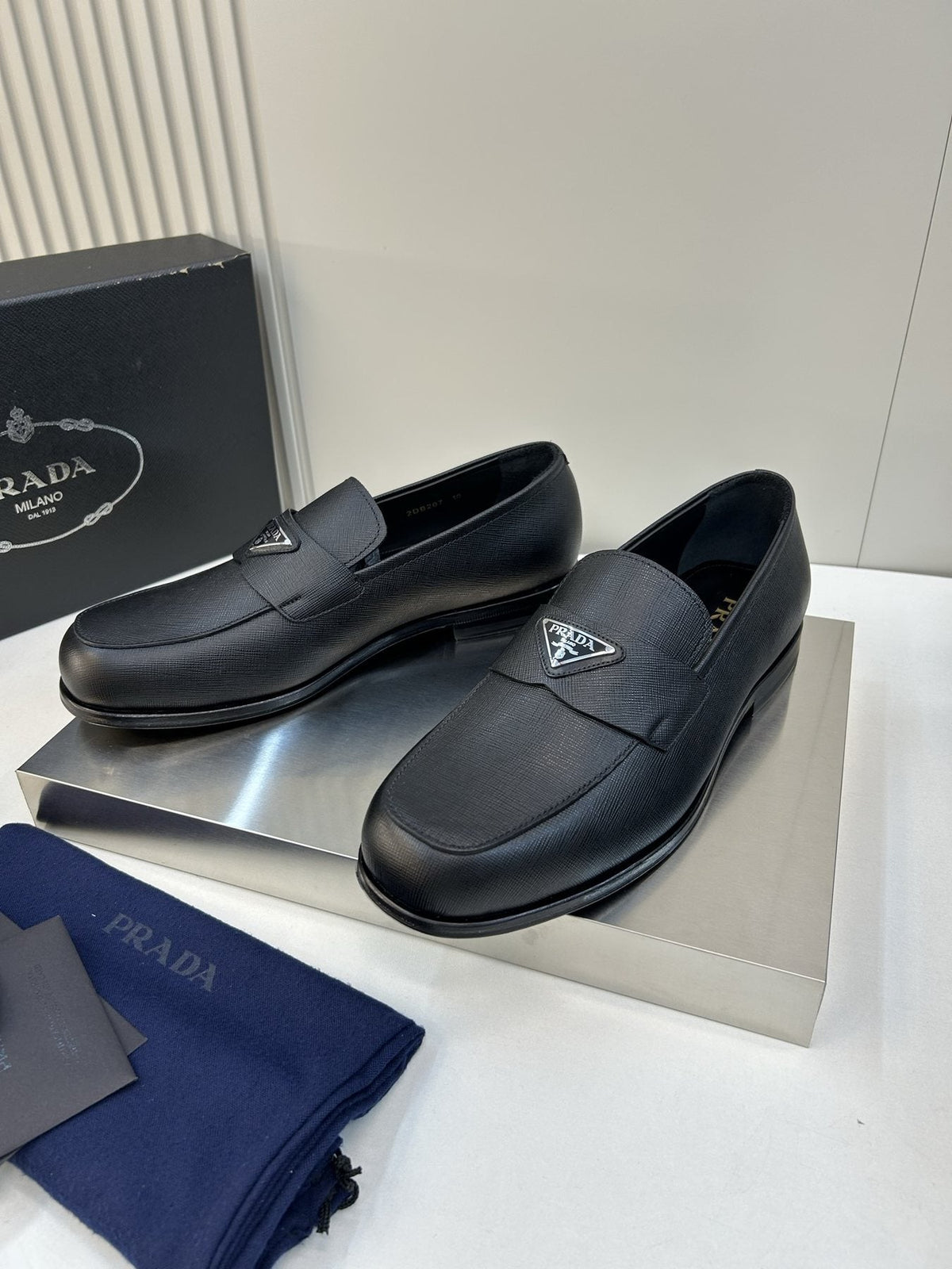 Prada Black Triangular Plaque Loafers — front