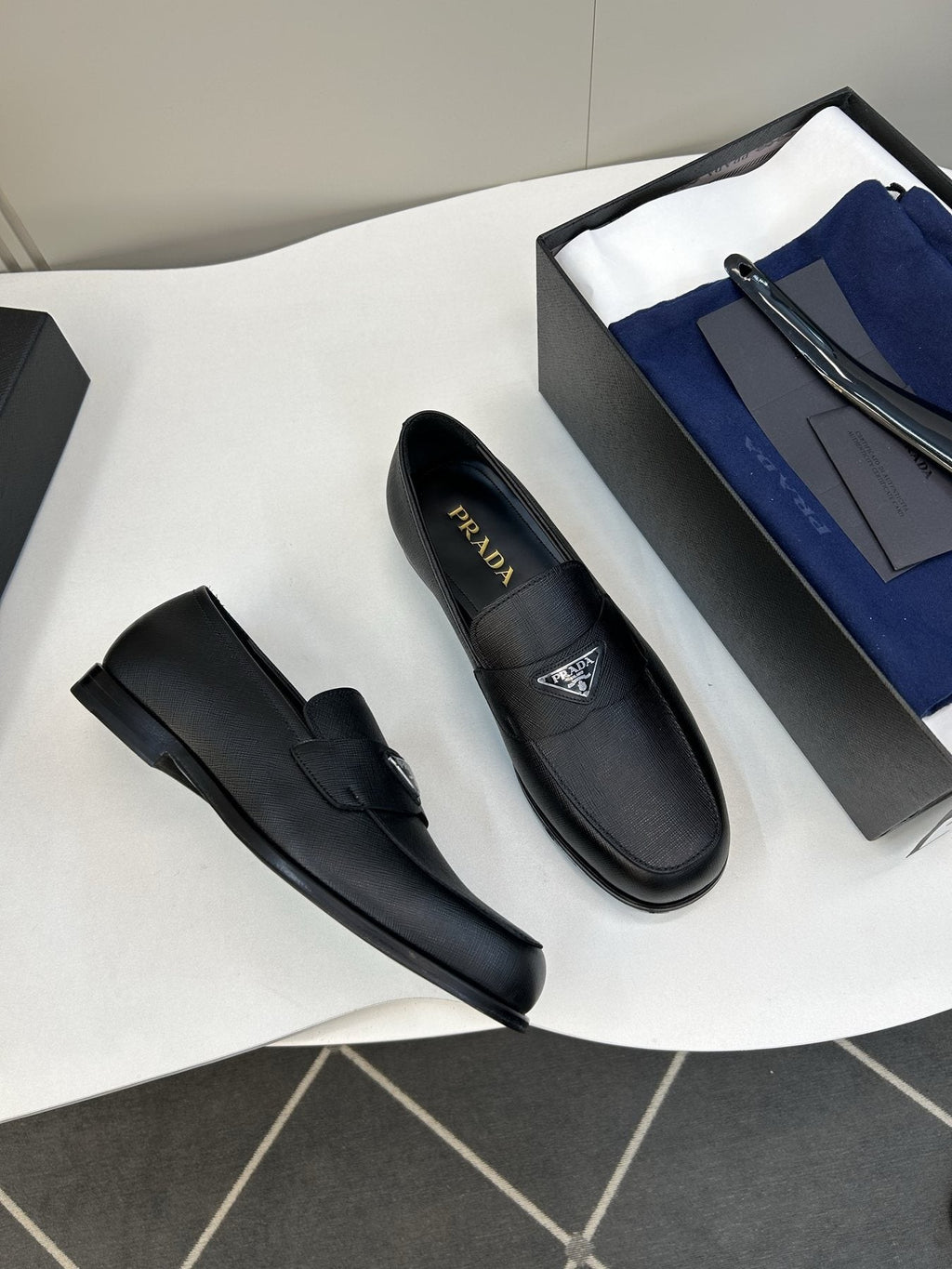 Prada Black Triangular Plaque Loafers — front