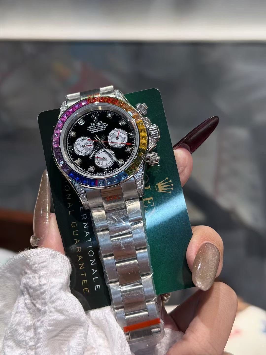 Rolex Rainbow Bezel Black Dial Watch — front