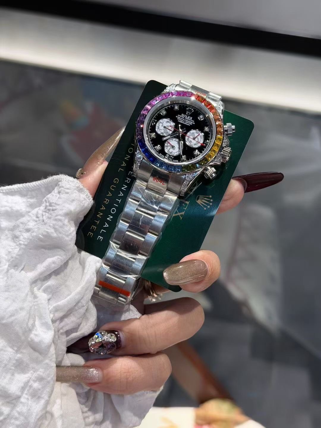 Rolex Rainbow Bezel Black Dial Watch — front