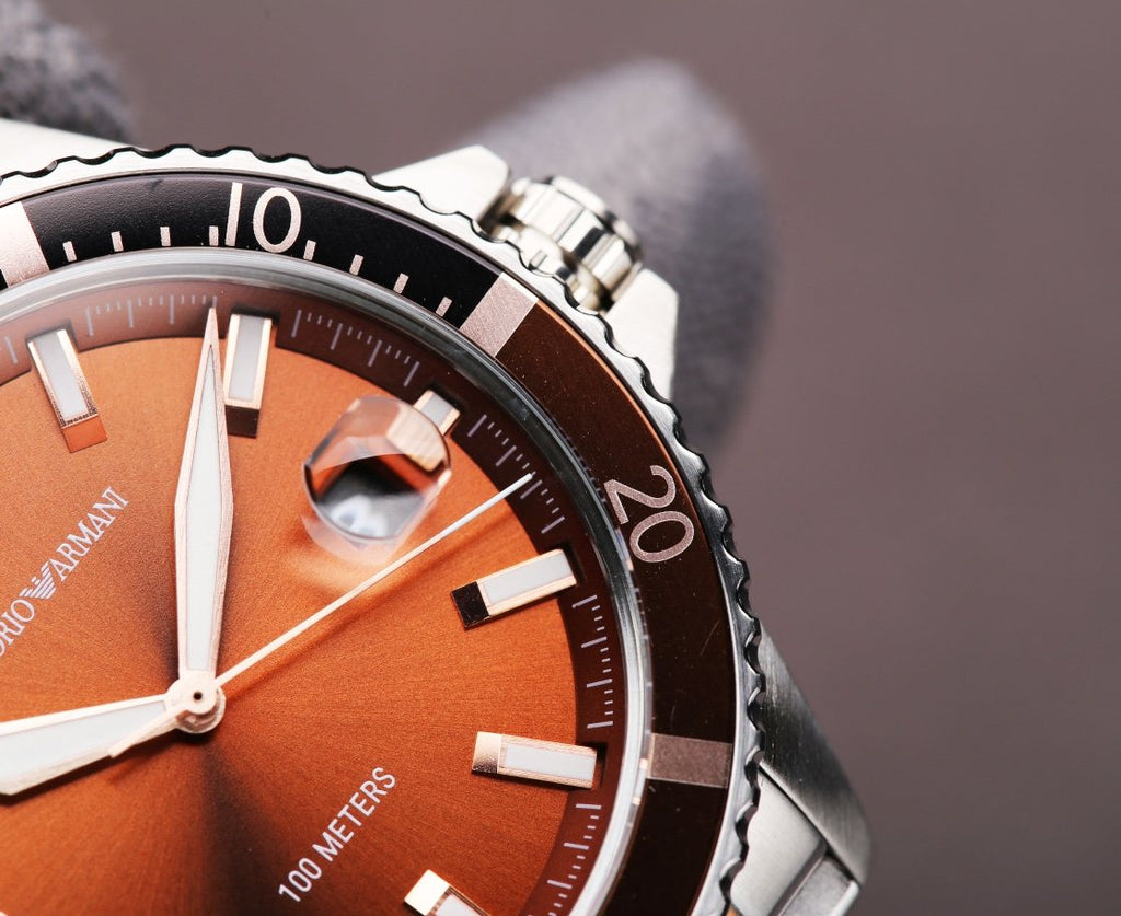 EMPORIO ARMANI Orange Dial Two-Tone Watch — detail