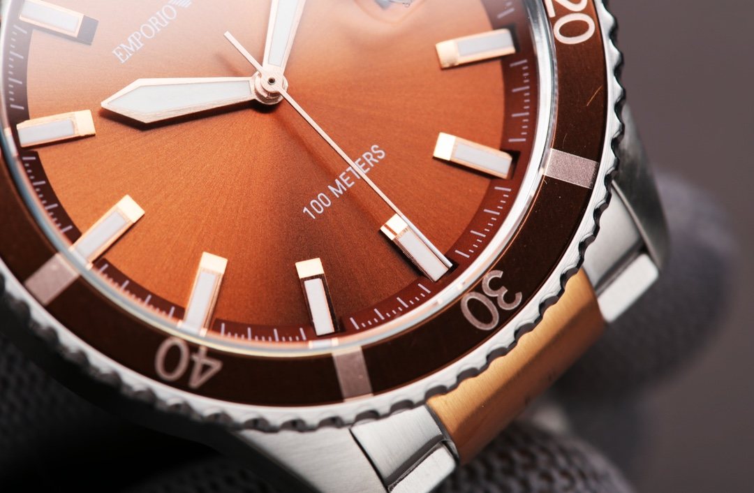 EMPORIO ARMANI Orange Dial Two-Tone Watch — detail