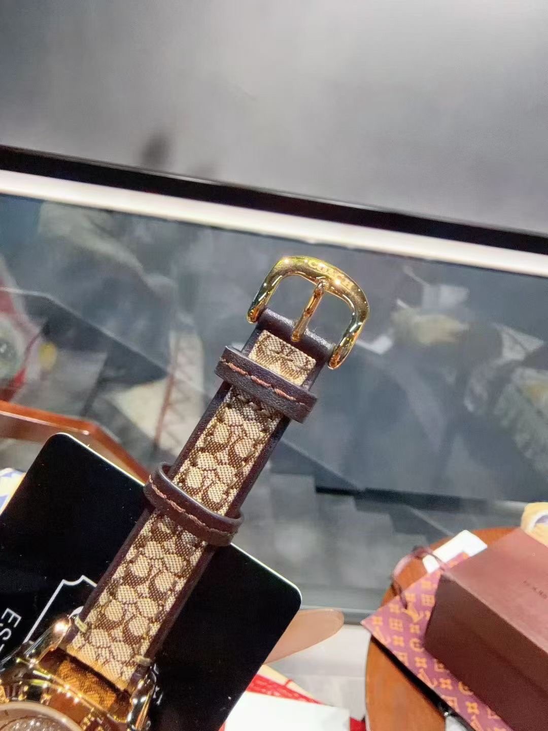 Coach Gold-Tone Patterned Strap Watch — detail